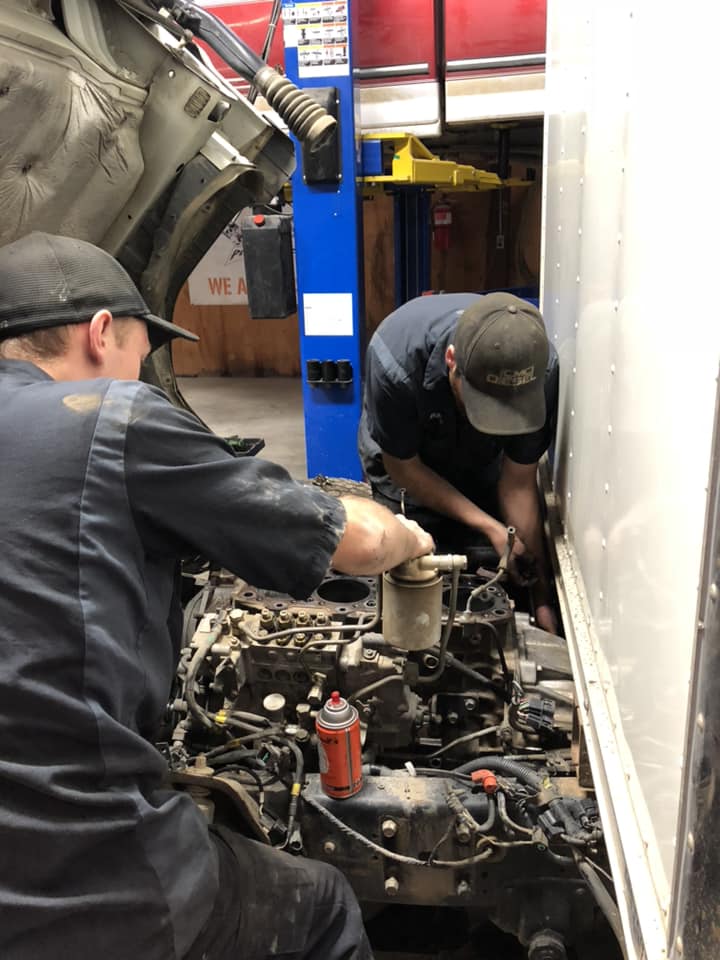 cmc diesel mechanics working on diesel engine
